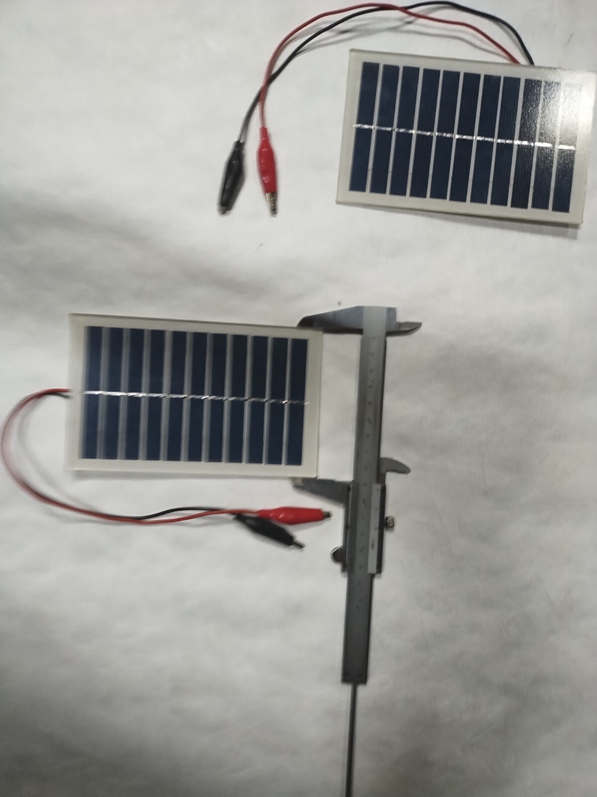 two small 6v solar panels with alligator clips glass
