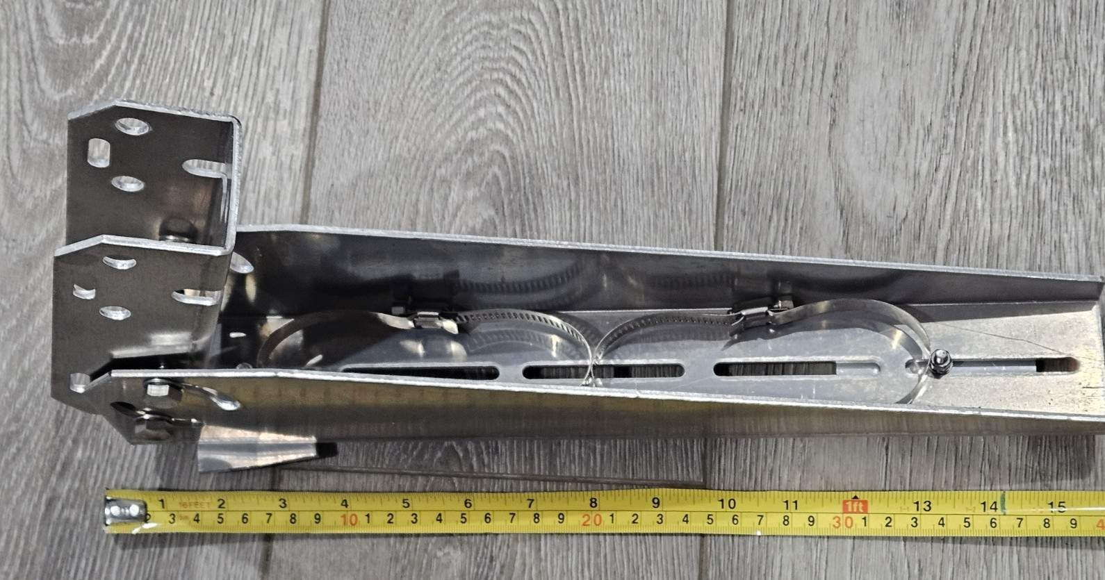 Adjustable angle bracket for pole mounting a small solar panel