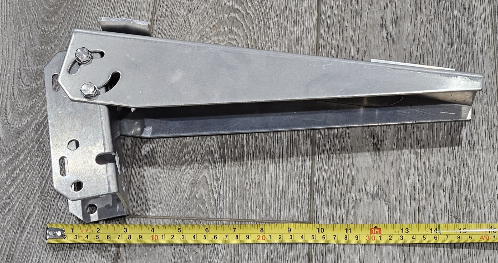Adjustable angle bracket for pole mounting a small solar panel