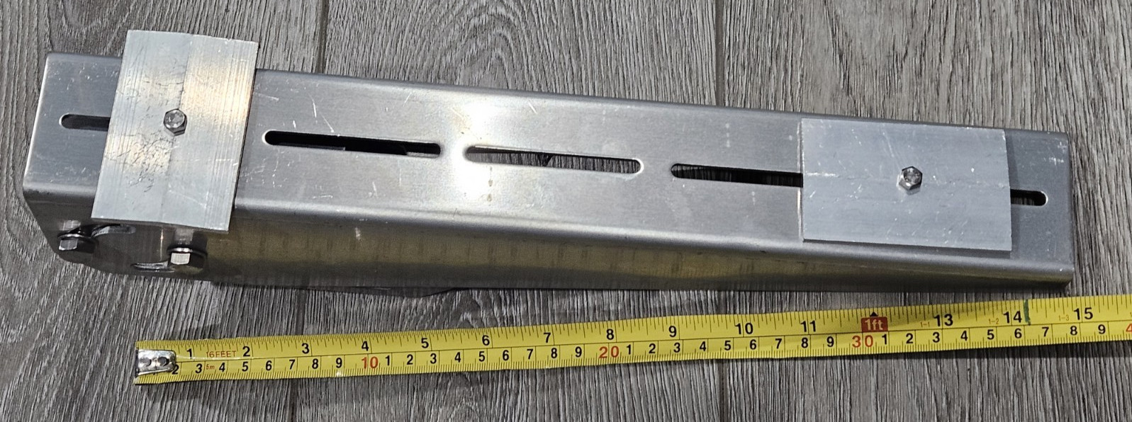 Adjustable angle bracket for pole mounting a small solar panel
